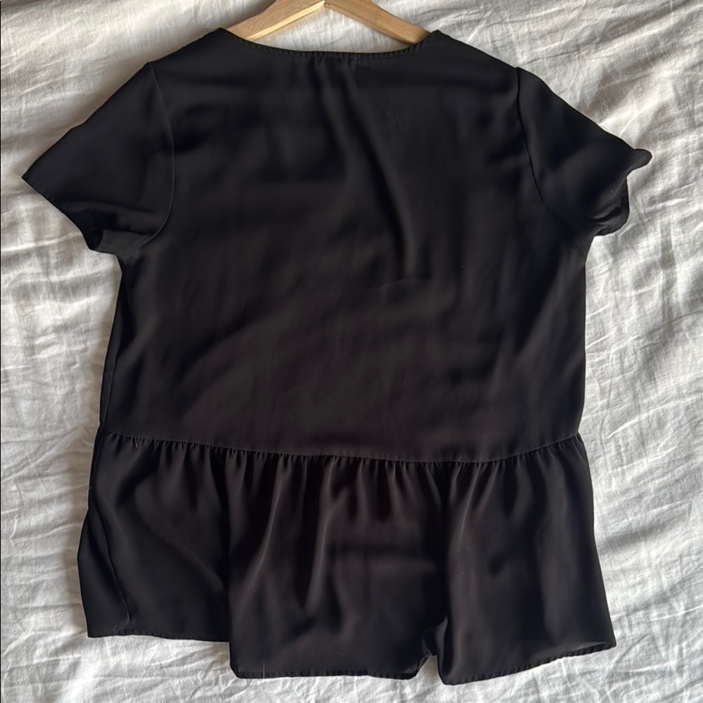 Pleione black top with Flowy Ruffled Back - Size Medium